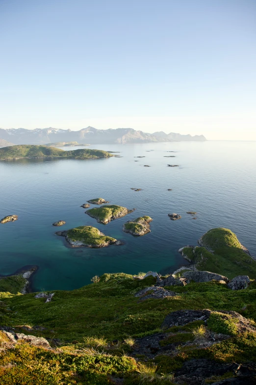 small island sits off the side of an ocean