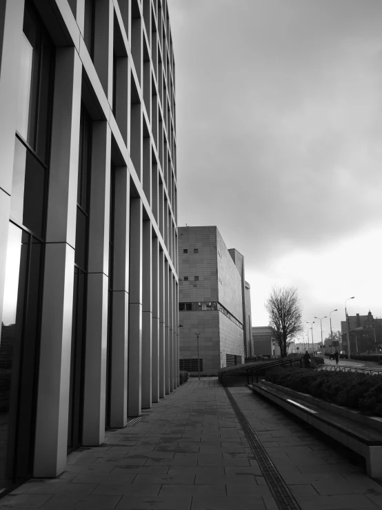 the building with the black and white image is near a path