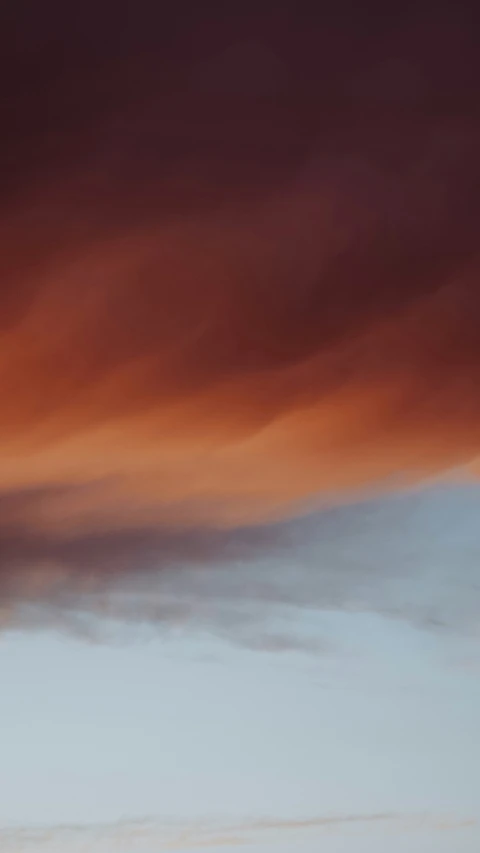 a large group of jetliners flying through a cloudy sky