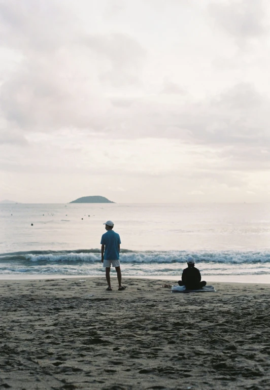 a person that is flying a kite on a beach