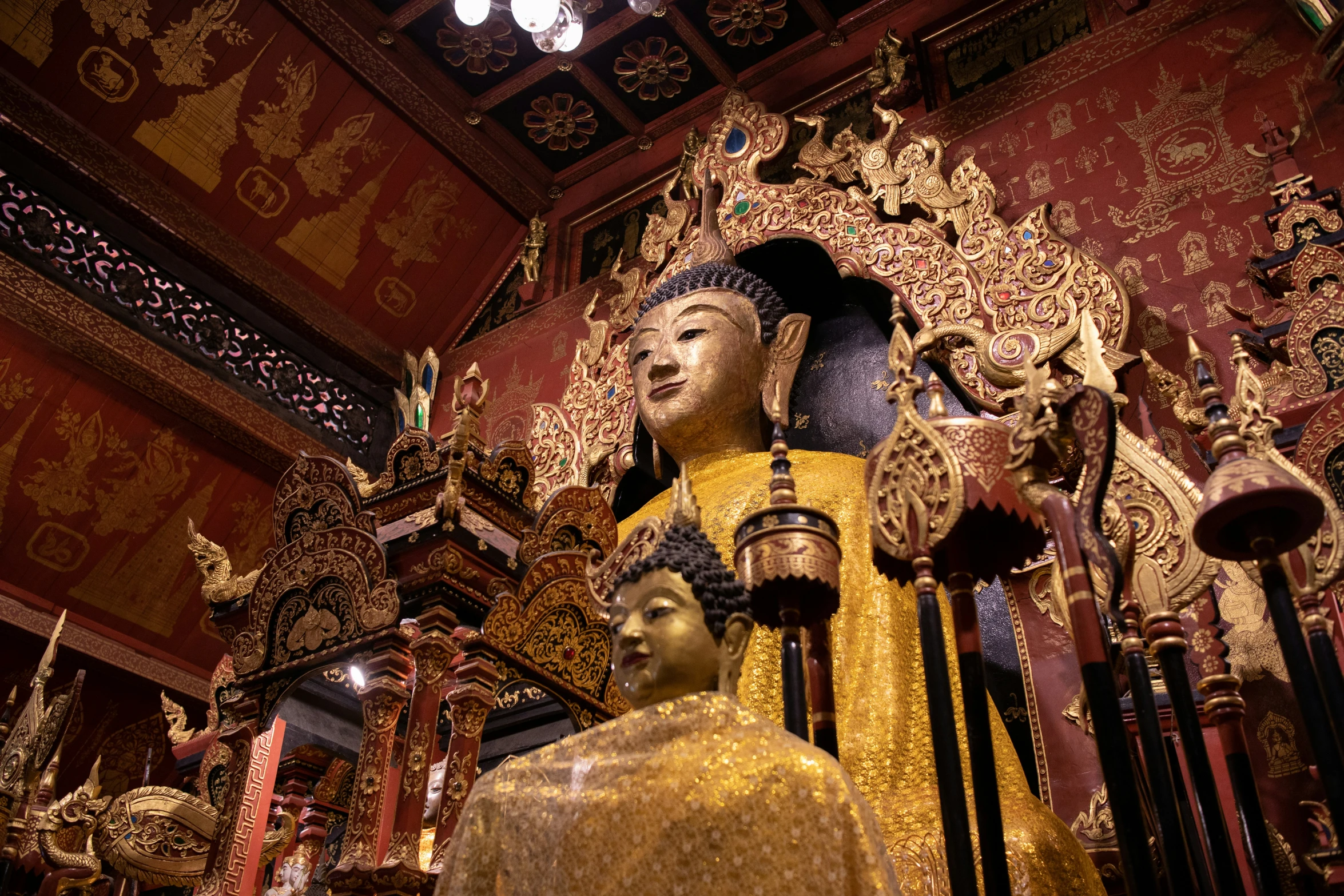 a statue in front of many ornate mirrors