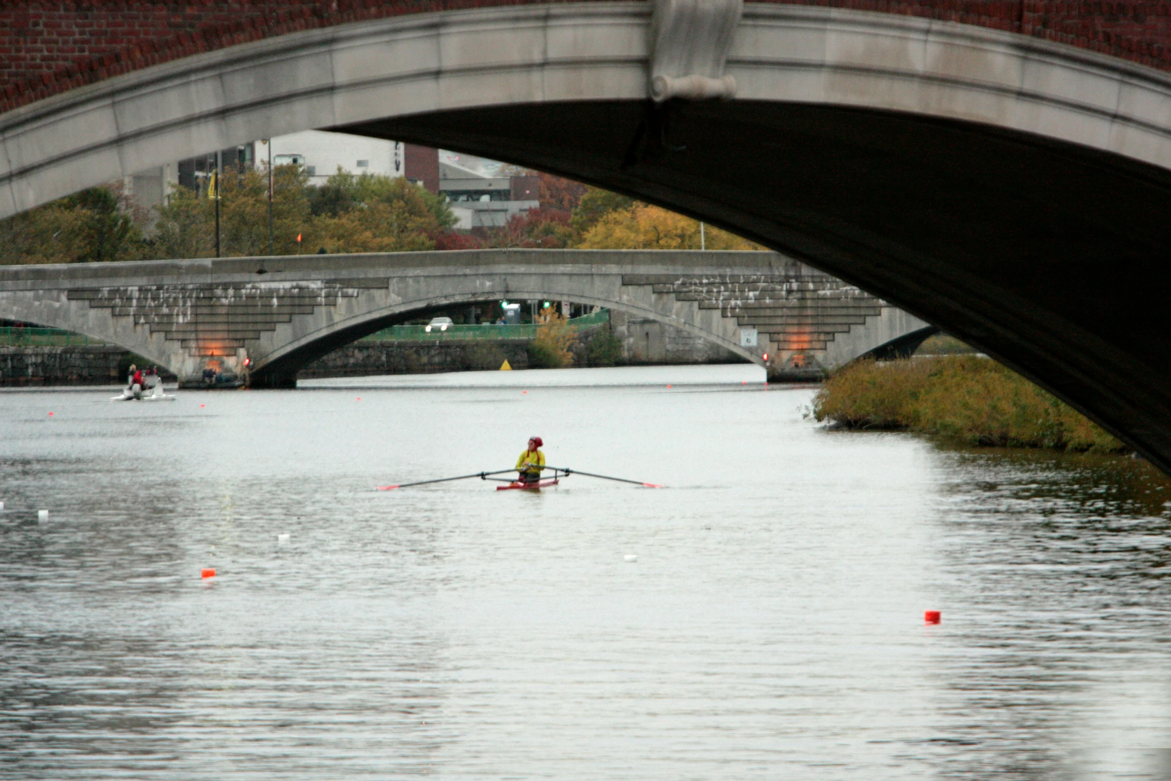 a man on the water rowing in a boat