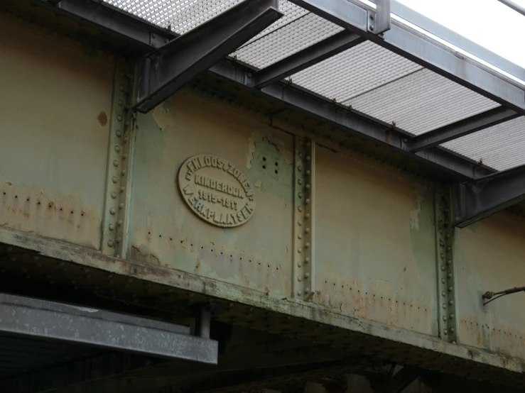 the name on the sign is written under an overpass