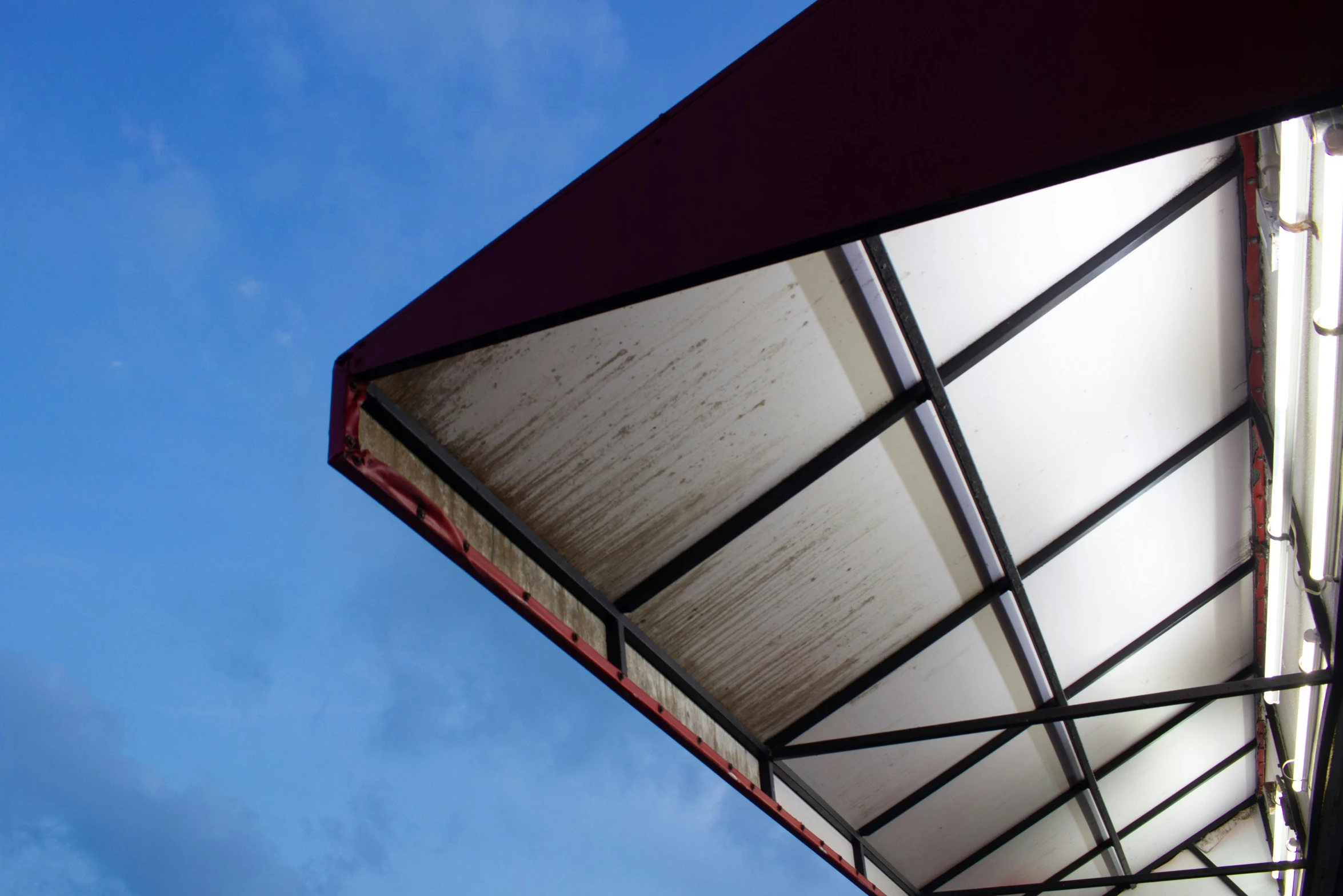 a sky background and a roof made with red and white sheets