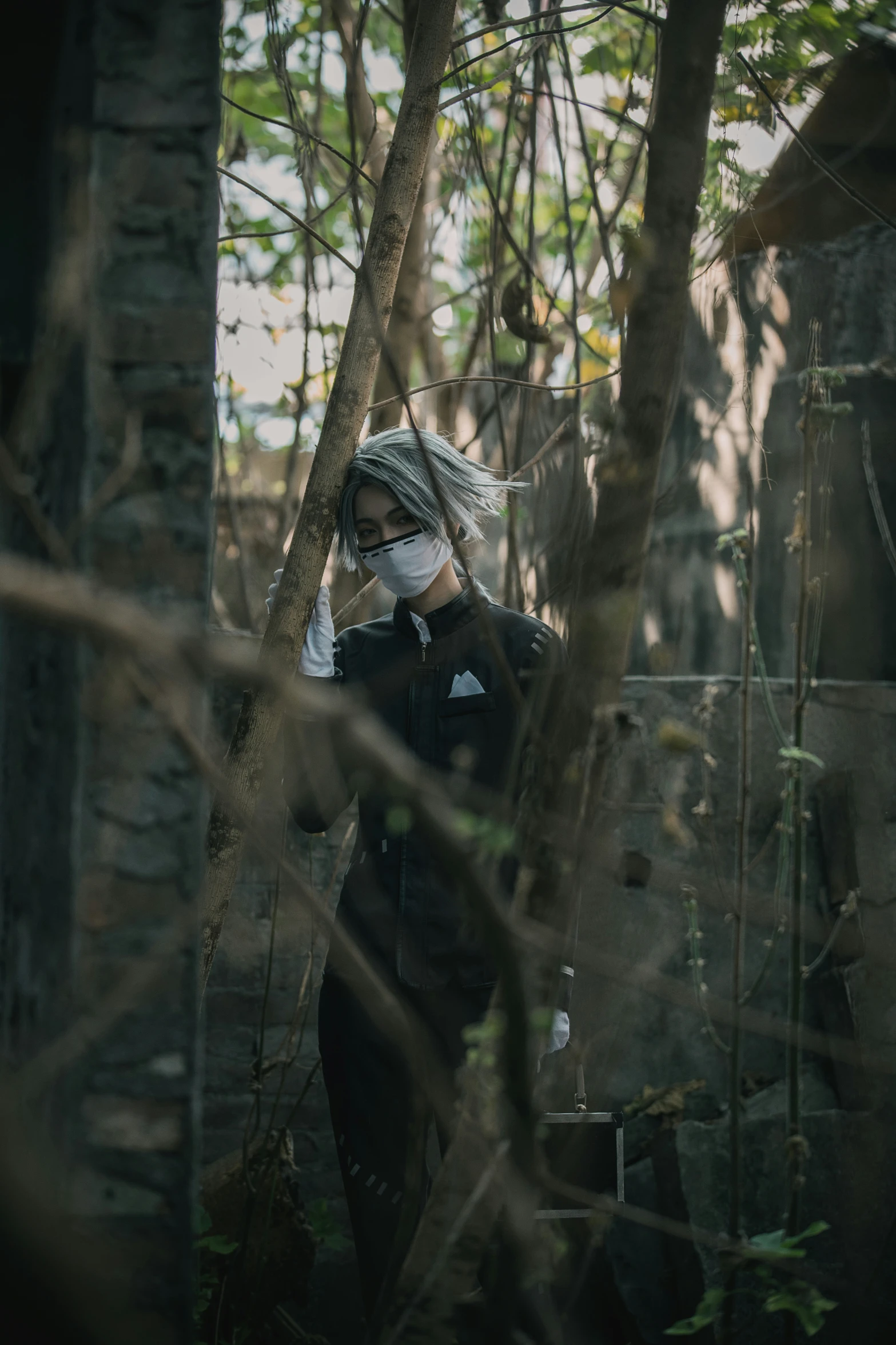 a woman standing on the forest wearing a face mask