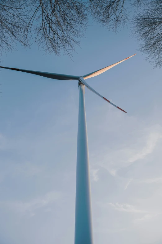 wind turbine against the blue sky during a sunny day