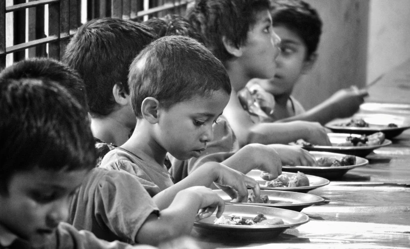 s are enjoying a meal at the table