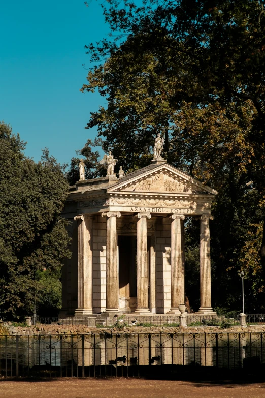 an image of the facade of a building near some trees