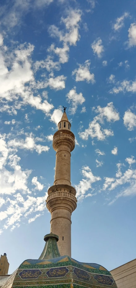 the tower of a building has a sky background