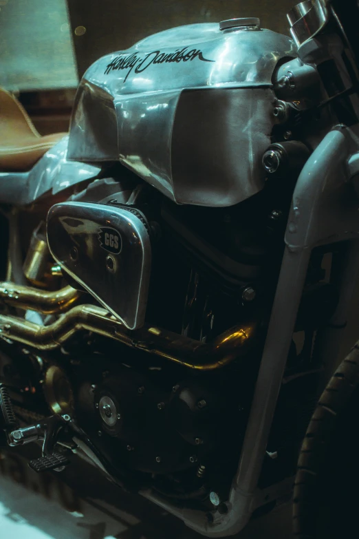 a motorcycle sitting parked next to a window in a garage