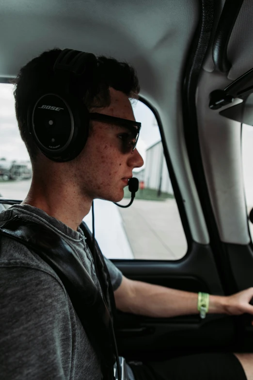 a person is in a truck driving and talking on his cellphone