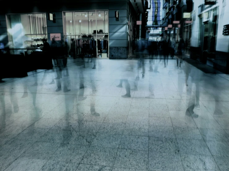 people are walking past a large building in a city