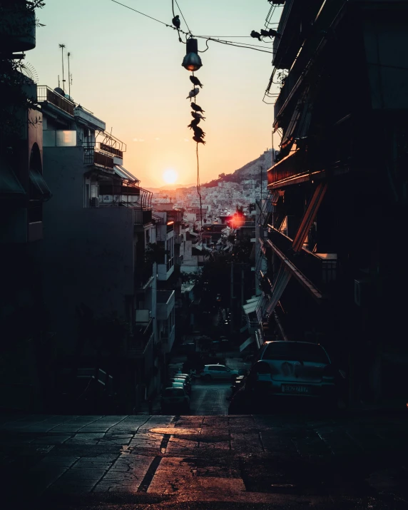 a silhouette of some buildings and some cars