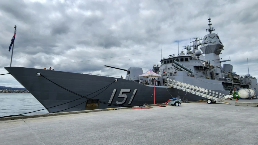 a big ship with a boat ladder going through it