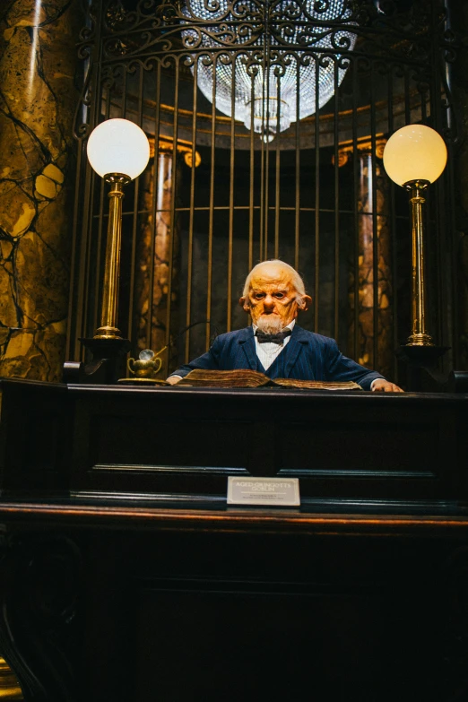 an old man sitting at a grand piano