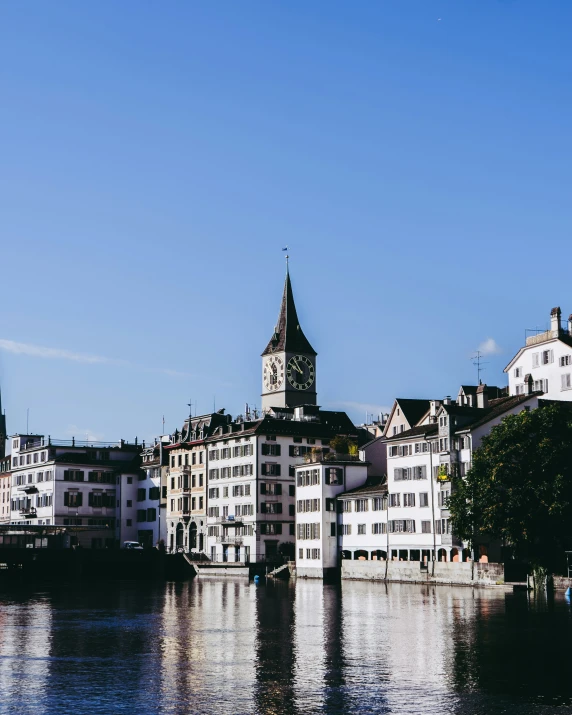 a very pretty town by the water with some tall buildings