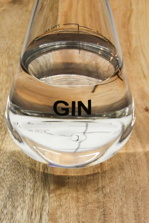 a glass cup sitting on top of a wooden table