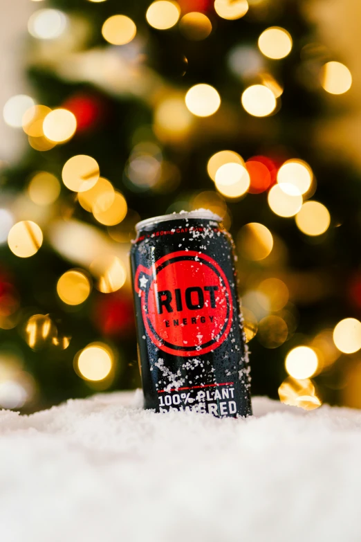 a can of rot next to a christmas tree