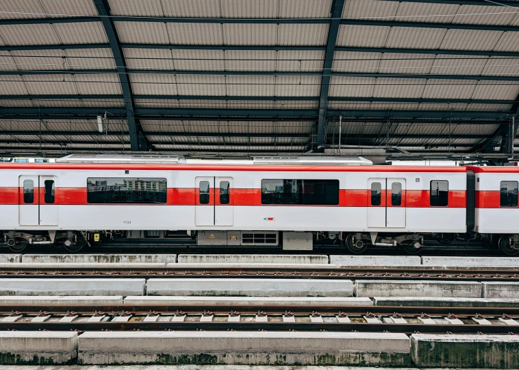 a train parked in a train station with lots of tracks