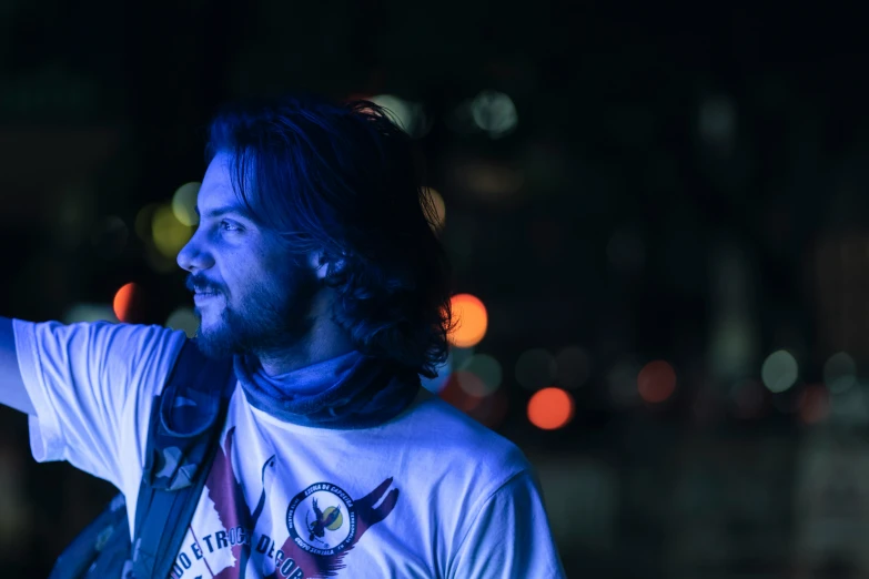 man in a dark place playing a guitar