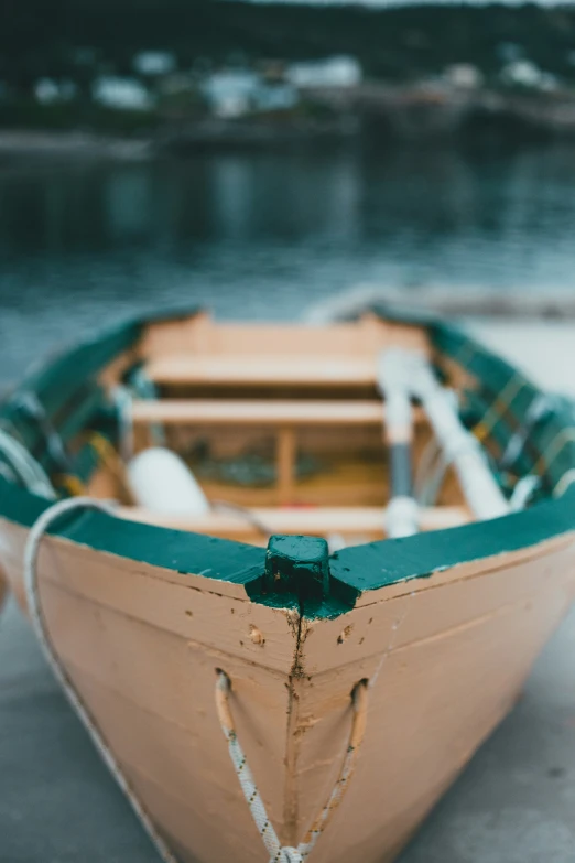 a small boat with a rope around the neck