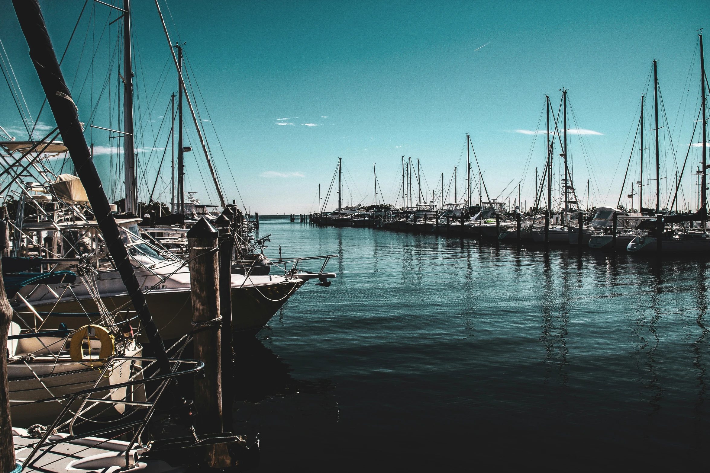 ships are sitting on the side of a dock