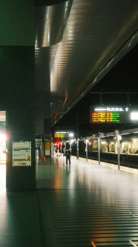 an empty platform with a sign hanging off the side of it