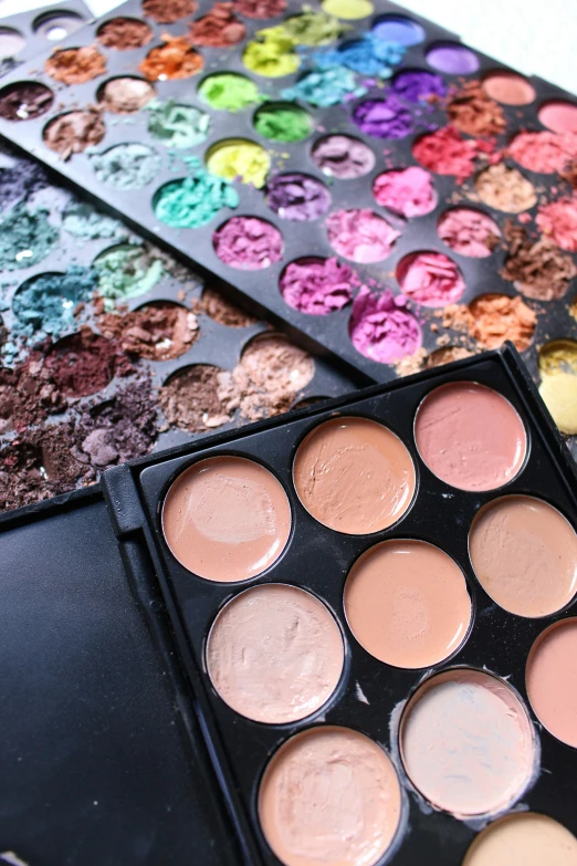 a close up of a makeup palette on a table