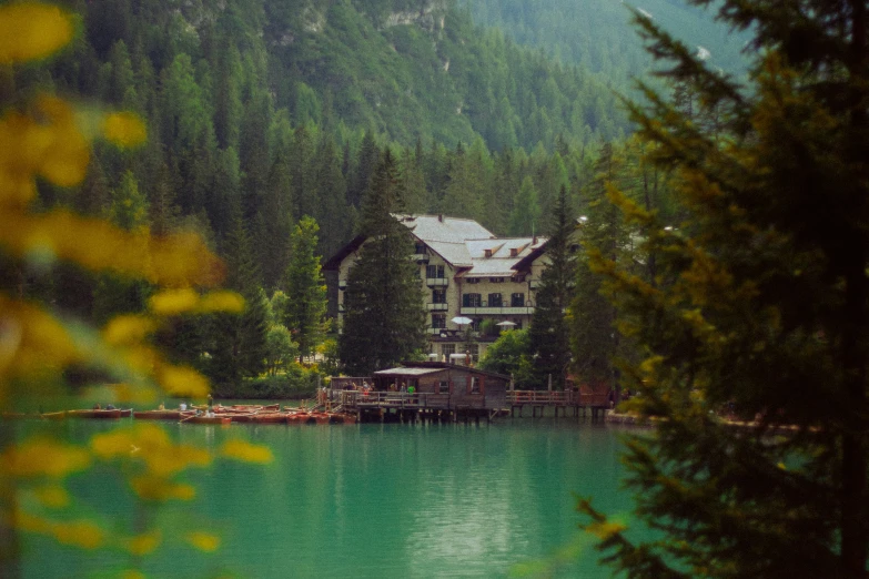 a lake with green water and several houses on it