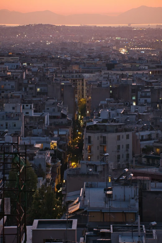 the city at twilight from above, has buildings and traffic lights on it