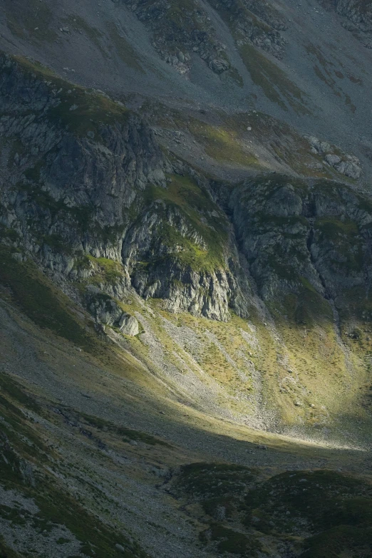 a po taken from below of a mountainous hillside