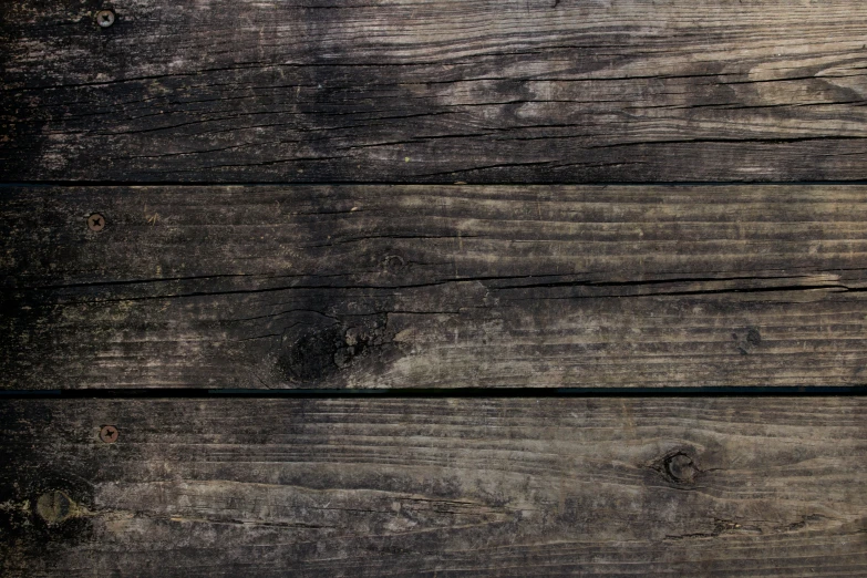 a red orange is on a wooden surface