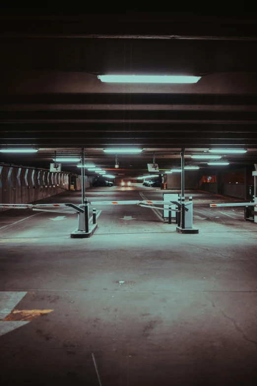 a parking lot with several lights at night