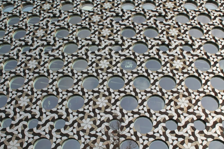 a large window with lots of small circle holes in it