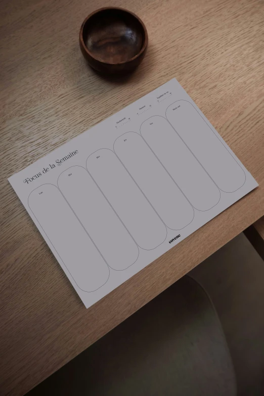 an empty notepad on top of a wooden table