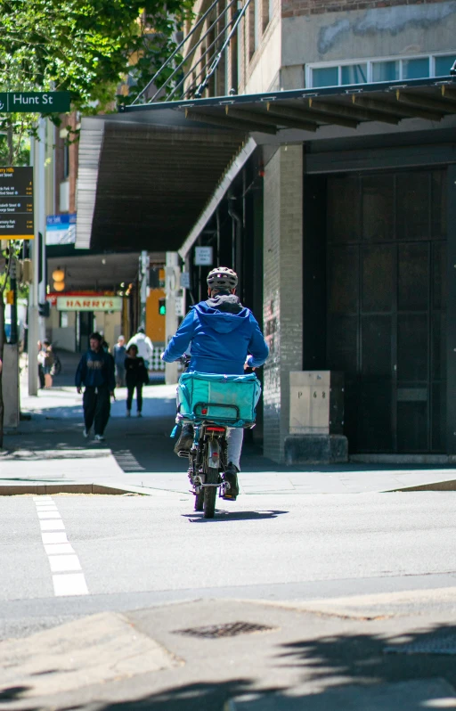 a person is riding a small bike on a city street