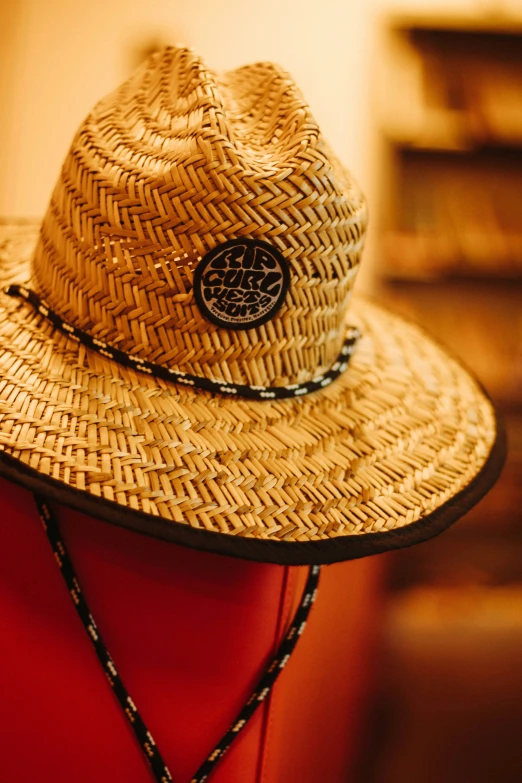 a straw hat that is sitting on a table