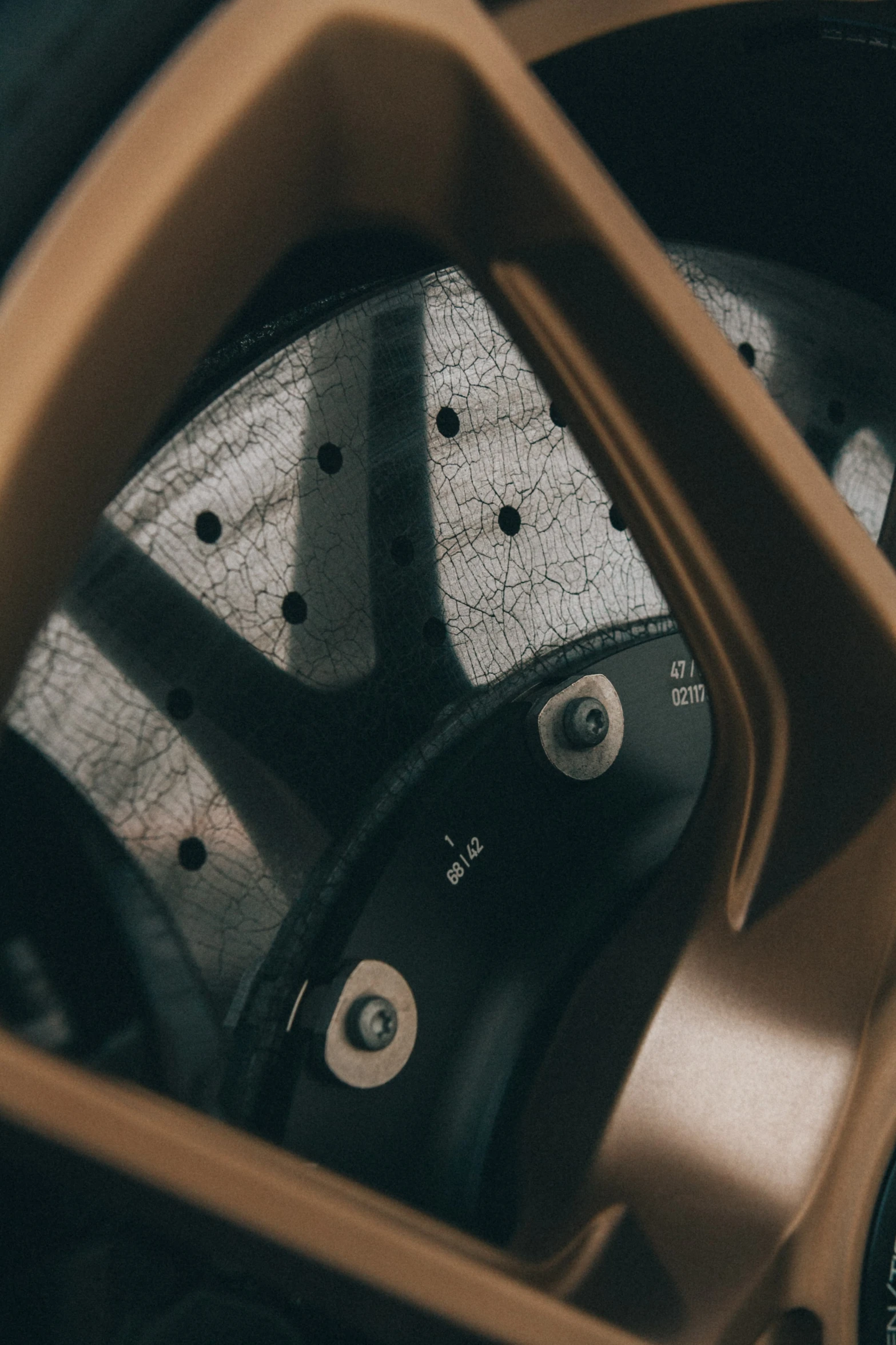 wheels and spokes in front of the wheel, looking into the mirror