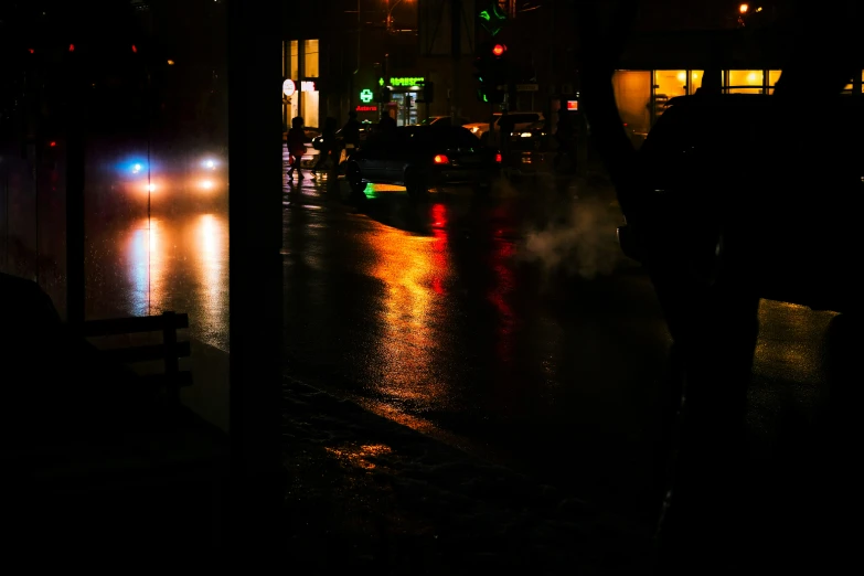 an image of cars and pedestrians in the rain