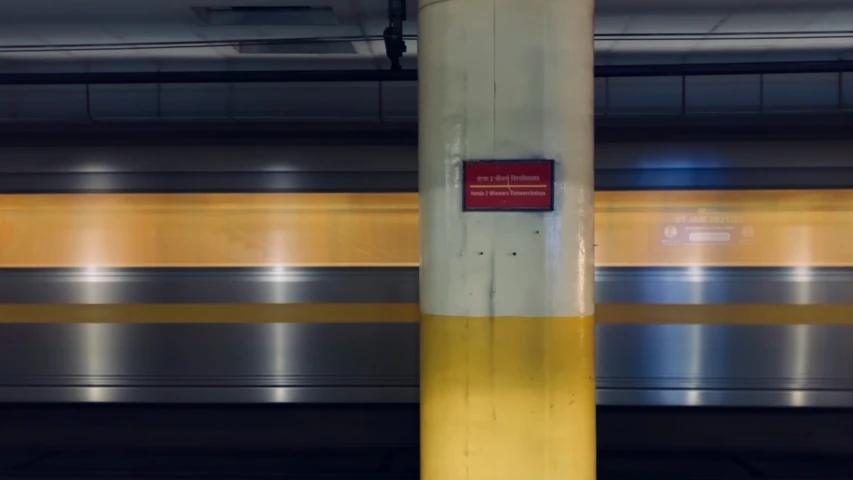 an out of service subway station with a train passing by