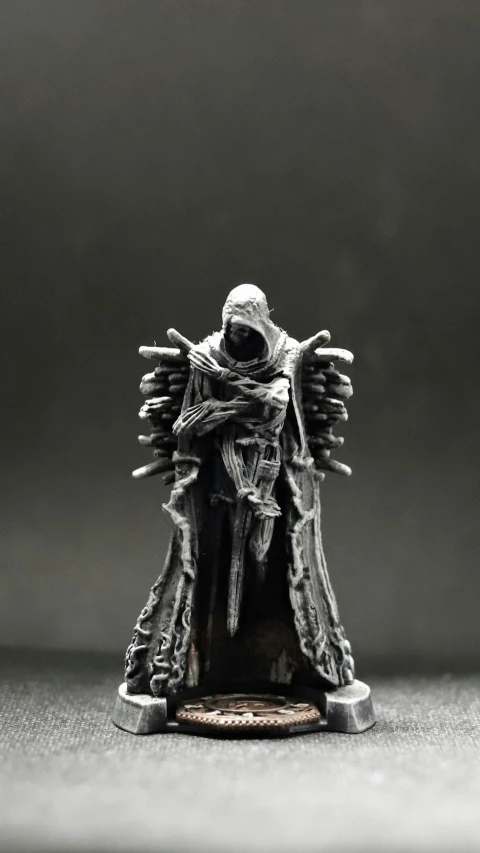 a black and white po of a miniature figurine