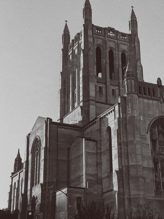 an old church with a tower next to a building