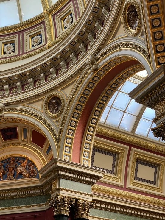 the large domed room has painted gold and red