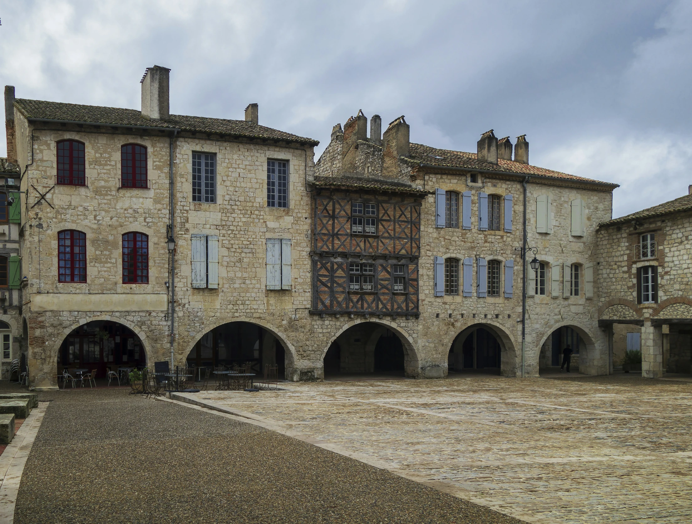 an empty courtyard and building on an overcast day