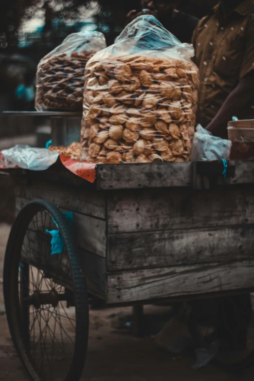 a wooden cart with food on top of it