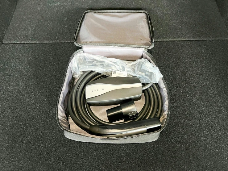 the inside of a small suitcase contains a large usb and power strip