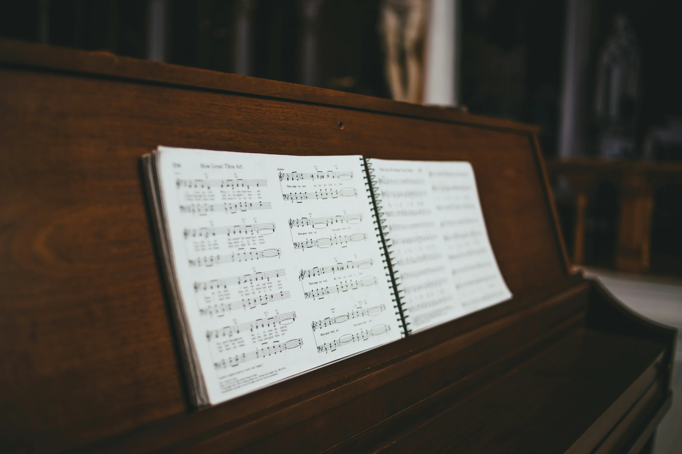 a close up of sheet music on a piano