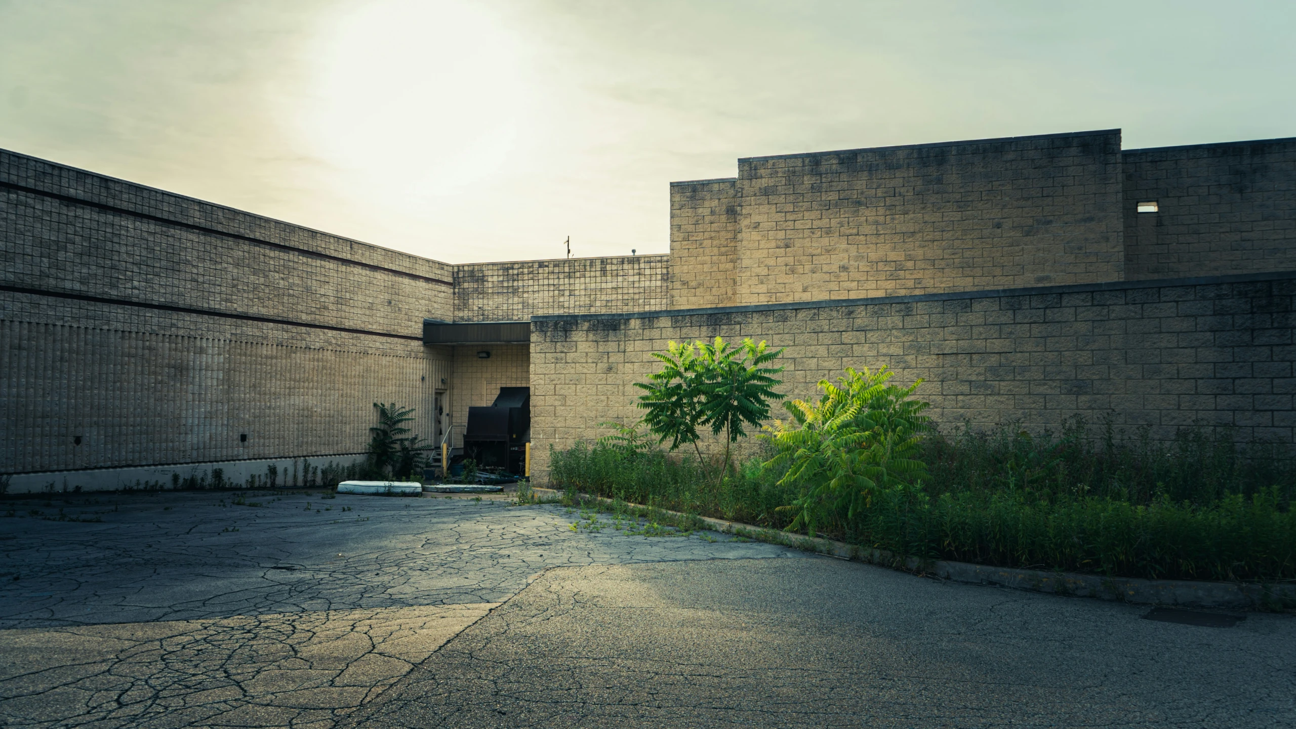 a deserted parking lot next to a building