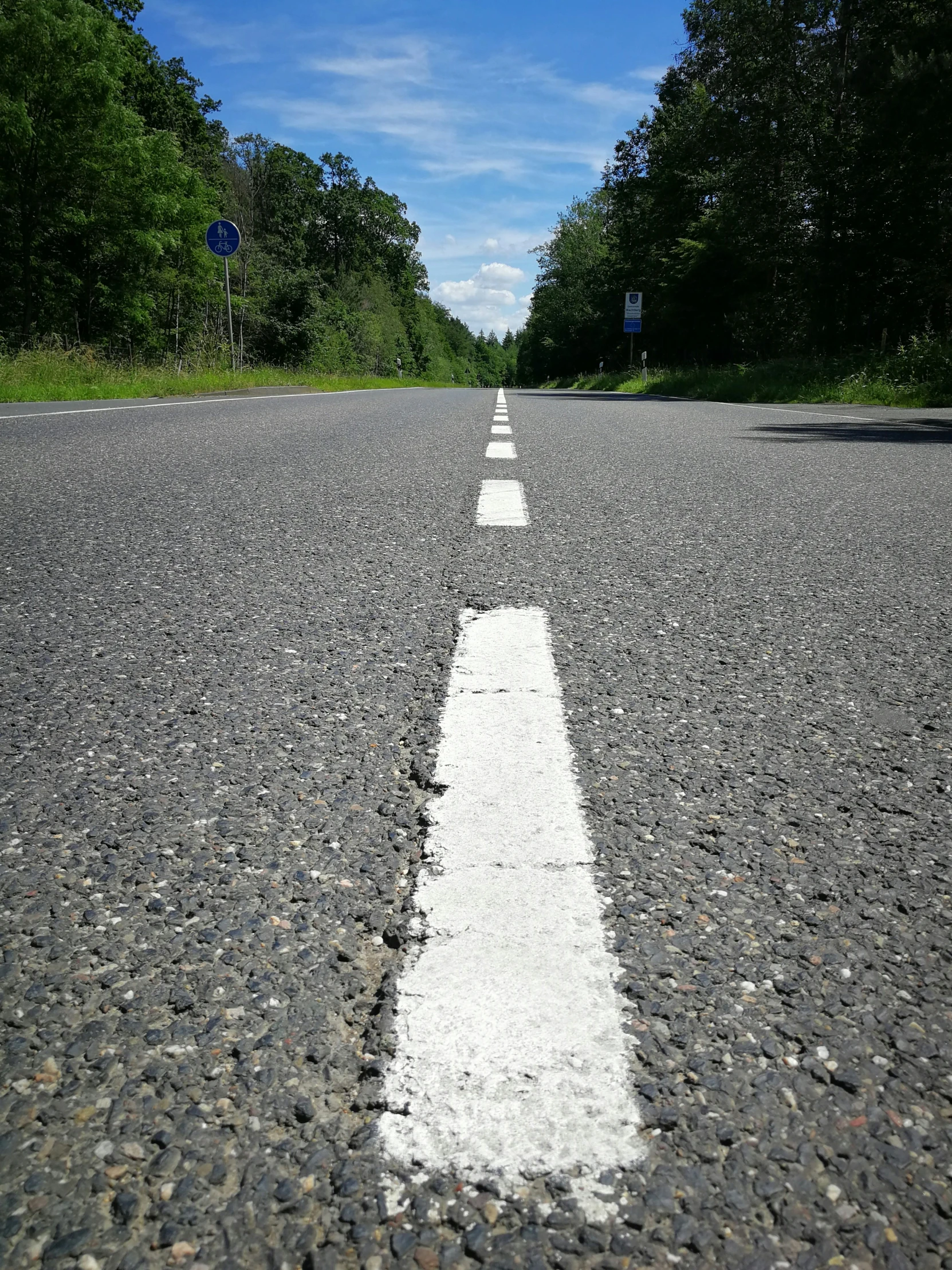 an empty street with an almost straight white line