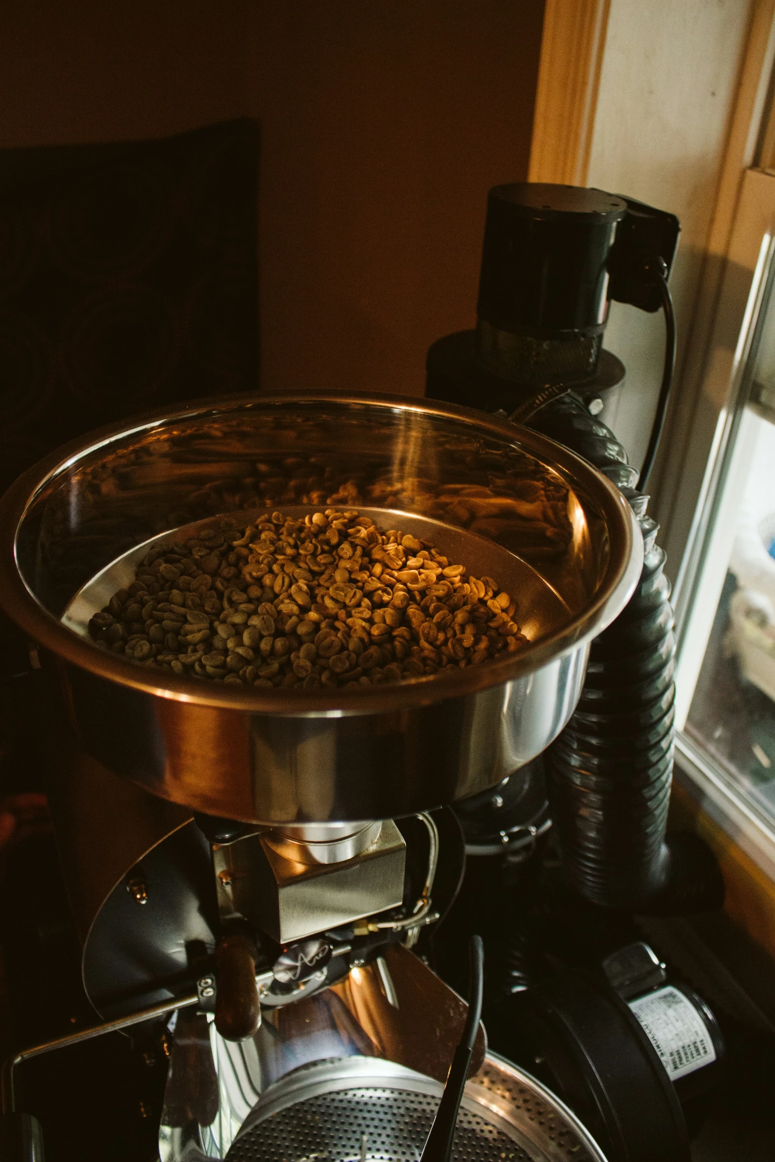 a metal fryer with a bowl full of food